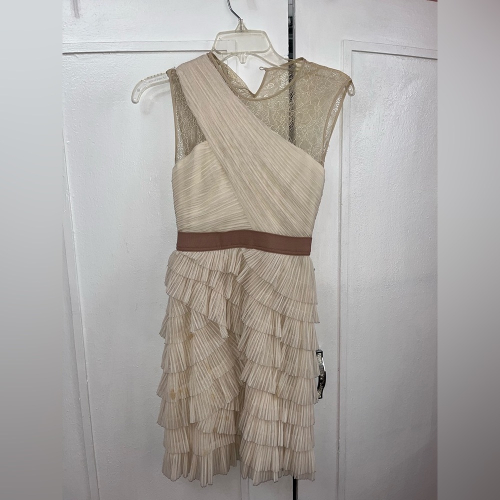This ruffled beige dress by BCBGMAXAZRIA is in ok condition-just needs a wash!!